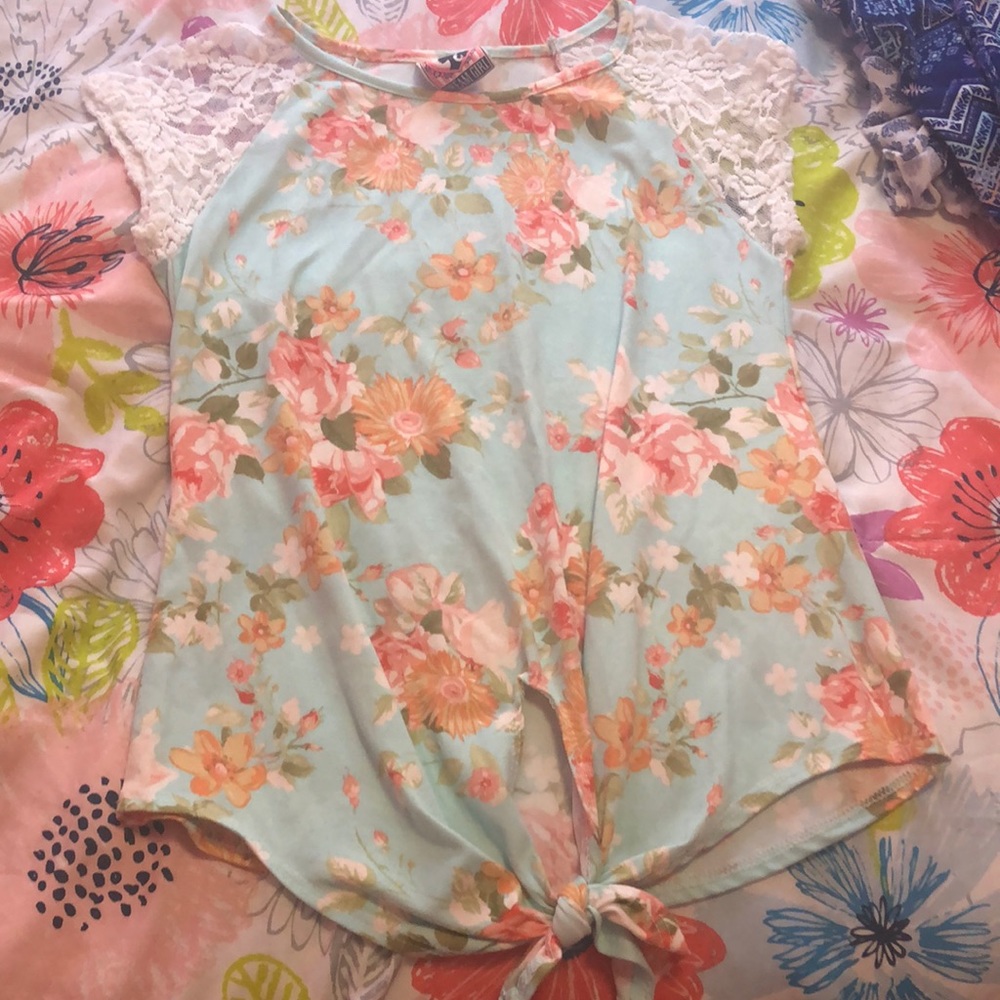 Dressy shirt with tie in front.
